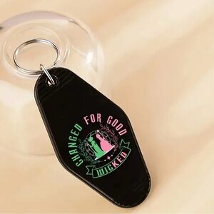 Wicked Themed Black Motel Keychain "Changed For Good" with Green & Pink NEW